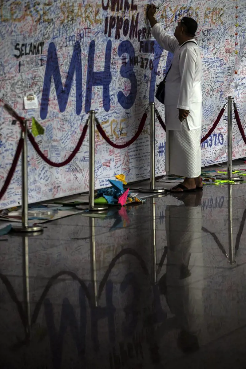 Il "muro della speranza" all'aeroporto di Kuala Lumpur