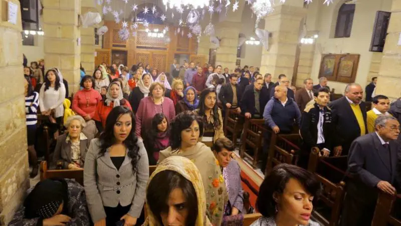 Fedeli copti alla messa della Vigilia nella chiesa della Vergine Maria / 6 gennaio 2014