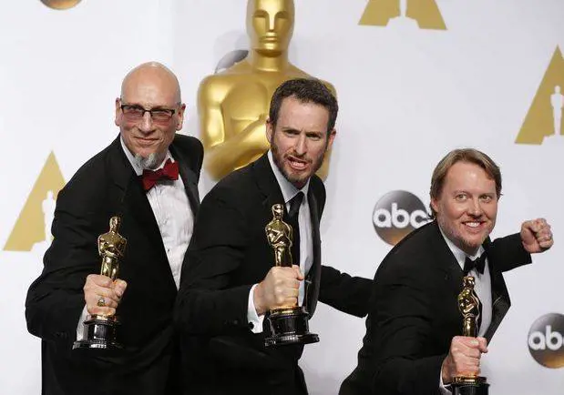 Miglior film d'animazione: Ron Conli, a sinistra, con Chris Williams e Don Hall con le statuette