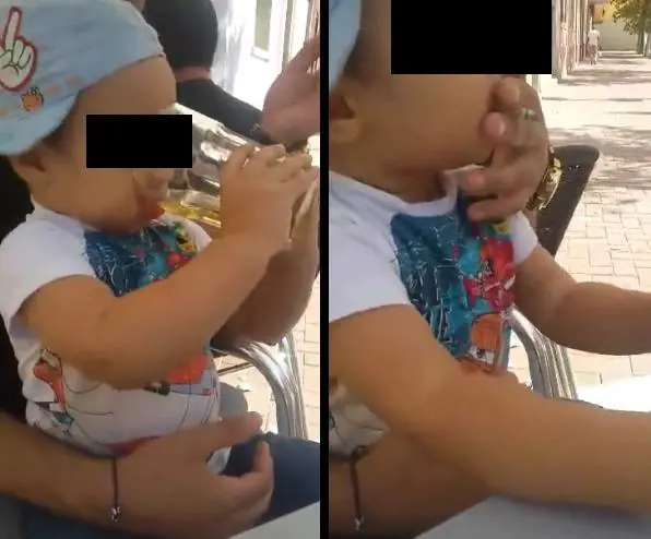 Video shock: bimbo beve birra e fuma una sigaretta
