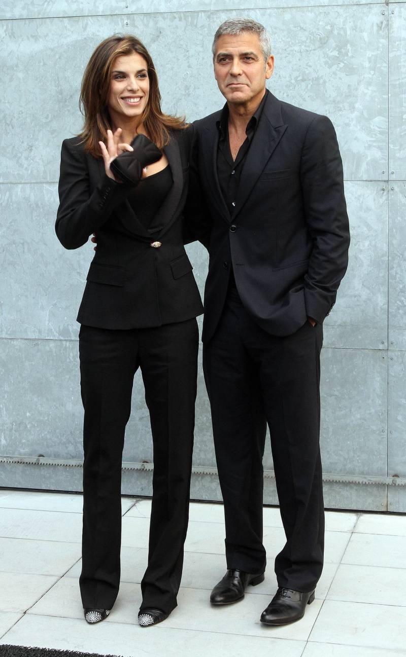 George Clooney e Elisabetta Canalis con Giorgio Armani alla sfilata dello stilista (settembre 2010)