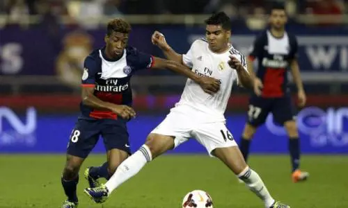 Coman  in azione con il centrocampista del Real Casemiro