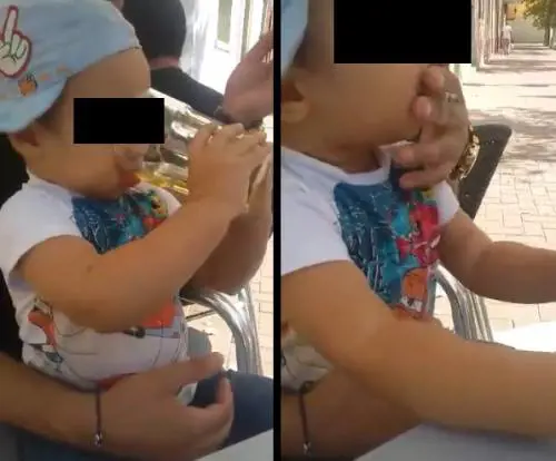Video shock: bimbo beve birra e fuma una sigaretta