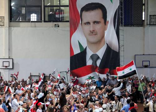 Una manifestazione in favore del regime nel quartiere di Mezzah a Damasco