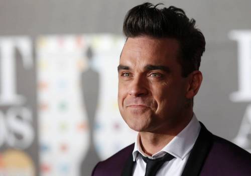 Robbie Williams umiliato dalla moglie: "A letto con lui fingo"
