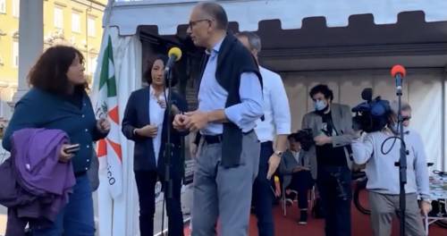 "Questa è libertà...?". Ed è scontro con Letta sul palco
