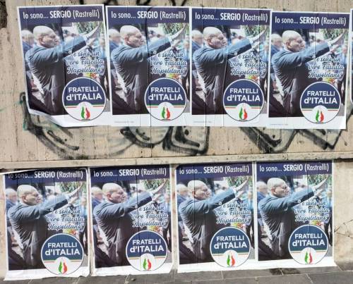 La guerra intestina di Fratelli d’Italia: manifesti in città con Rastrelli che fa il saluto fascista