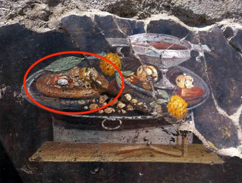 Pompei, scoperta un'antenata della "pizza" in un'affresco di 2000 anni fa