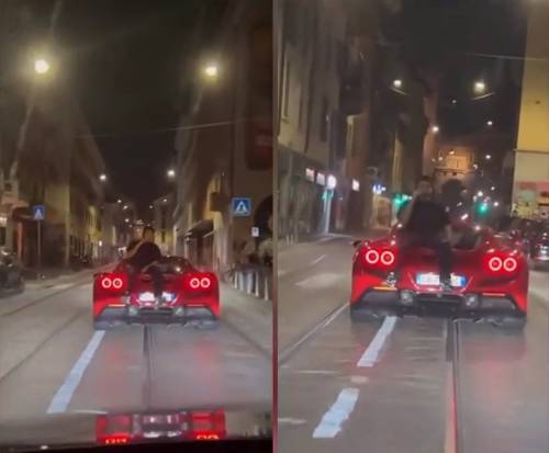 Ultima follia a Milano: al cellulare seduto su una Ferrari