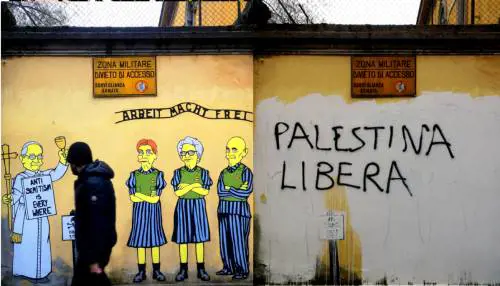 Sfregio alla memoria dell'Olocausto: pro Pal imbrattano il murale per Segre, Bruck e Modiano