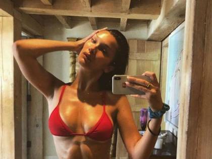 Bella Hadid sexy in costume rosso
