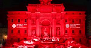 La Fontana di Trevi colorata di rosso dal "sangue" dei cristiani perseguitati