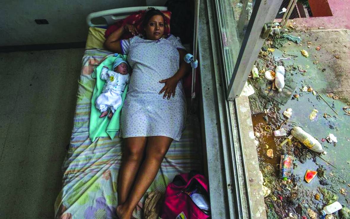 Venezuela, la foto della vergogna Così si nasce (e muore) con Maduro