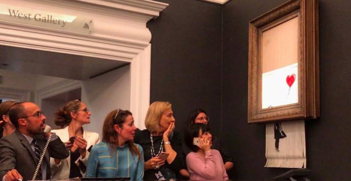 Banksy, l'opera da 1 milione di euro si autodistrugge dopo l'asta